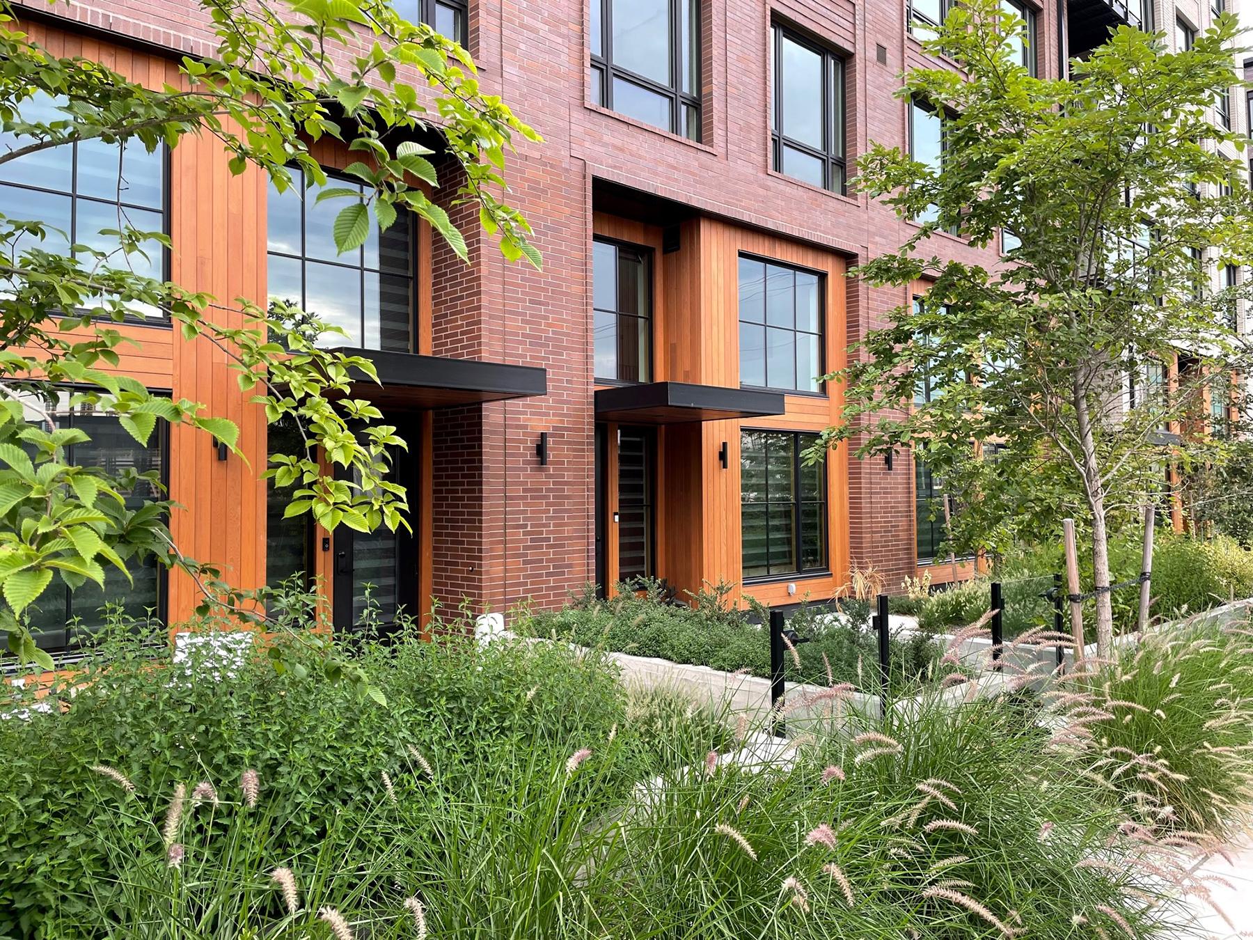 Brick and wood residential with landscaping